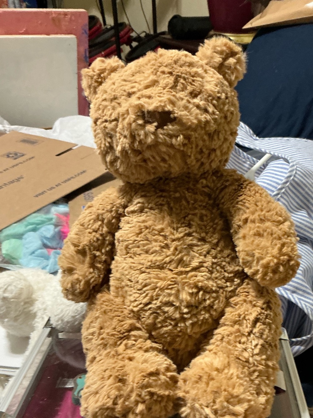Authentic Jellycat Bartholomew Bear plush in warm toffee brown.